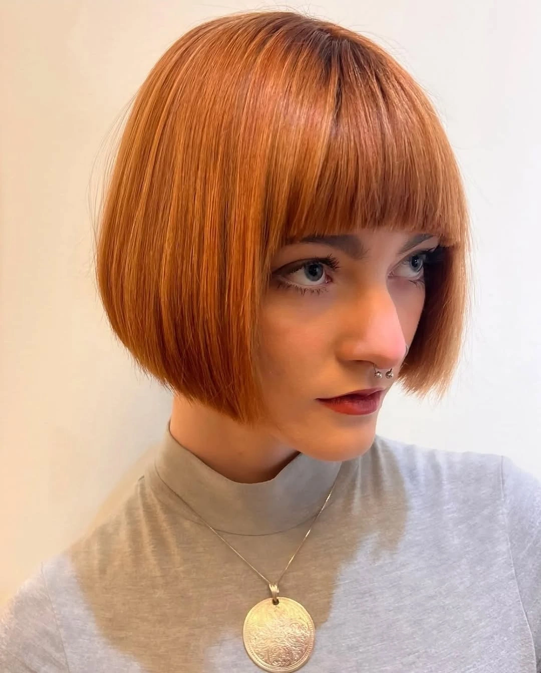 short bobbed hairstyle Rounded Ginger Bob With Soft Full Fringe