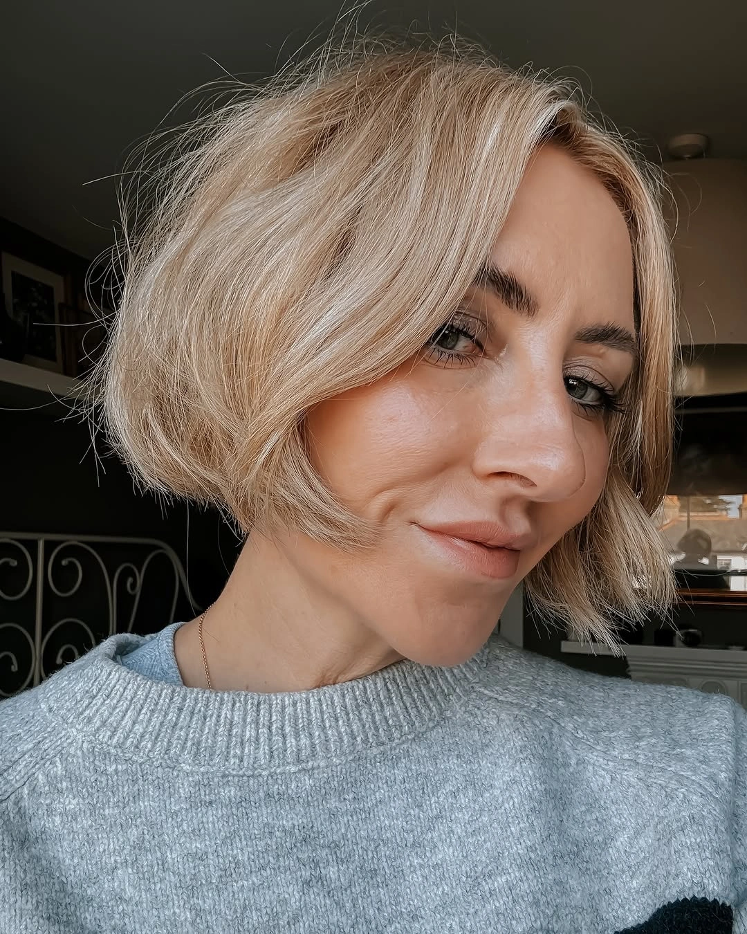 short bobbed hairstyle French-Inspired Blonde Bob With Soft Curtain Bangs