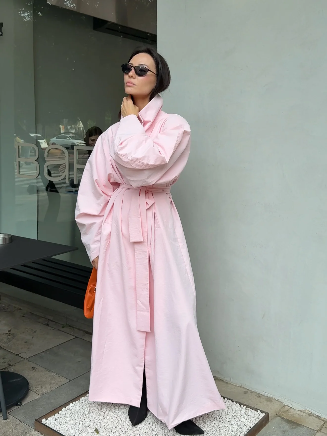 Trench coat fall outfits 2026 Soft Pink Makes A Trench Feel Unexpected