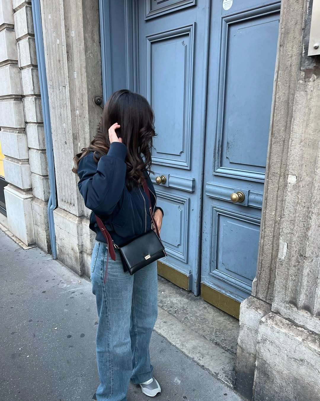 wide leg jeans outfit fall 2026 City Layers With a Minimal Bomber Jacket