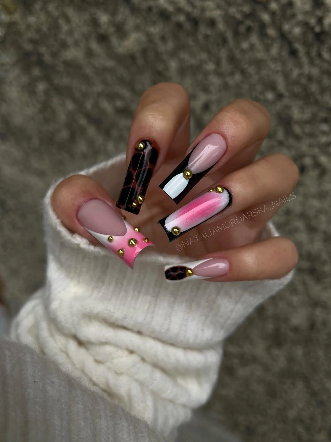 Long pointed nails with brown, copper, gold, and pale pink geometry