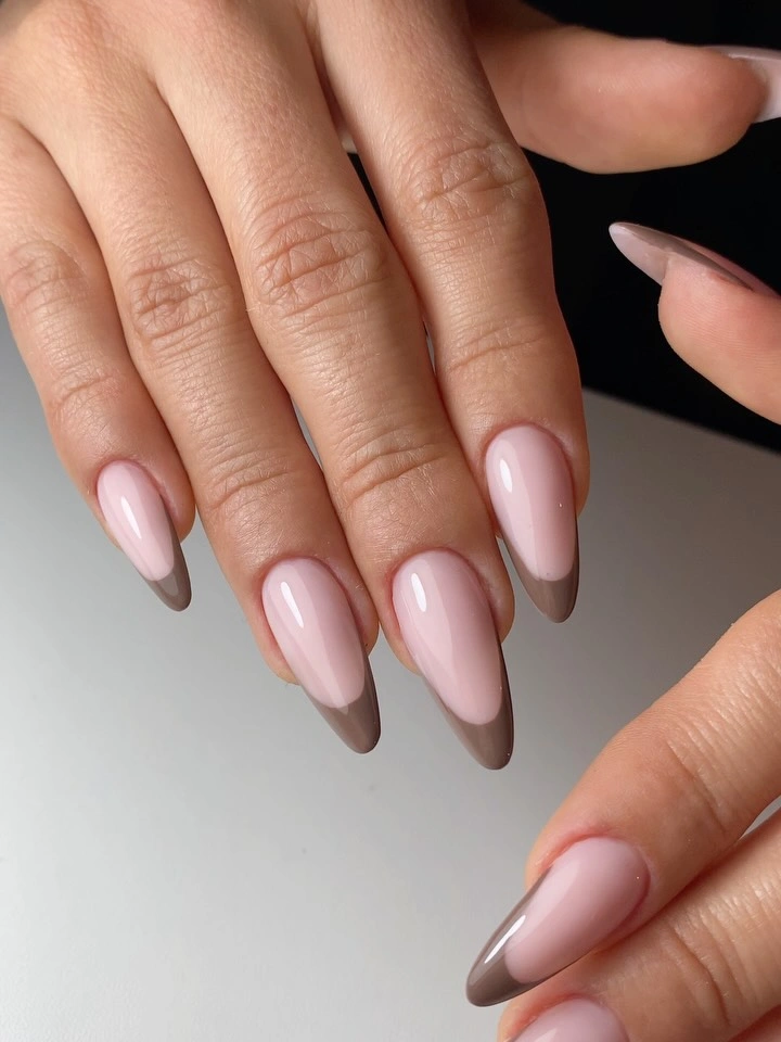 Medium almond sheer pink nails with subtle taupe edging