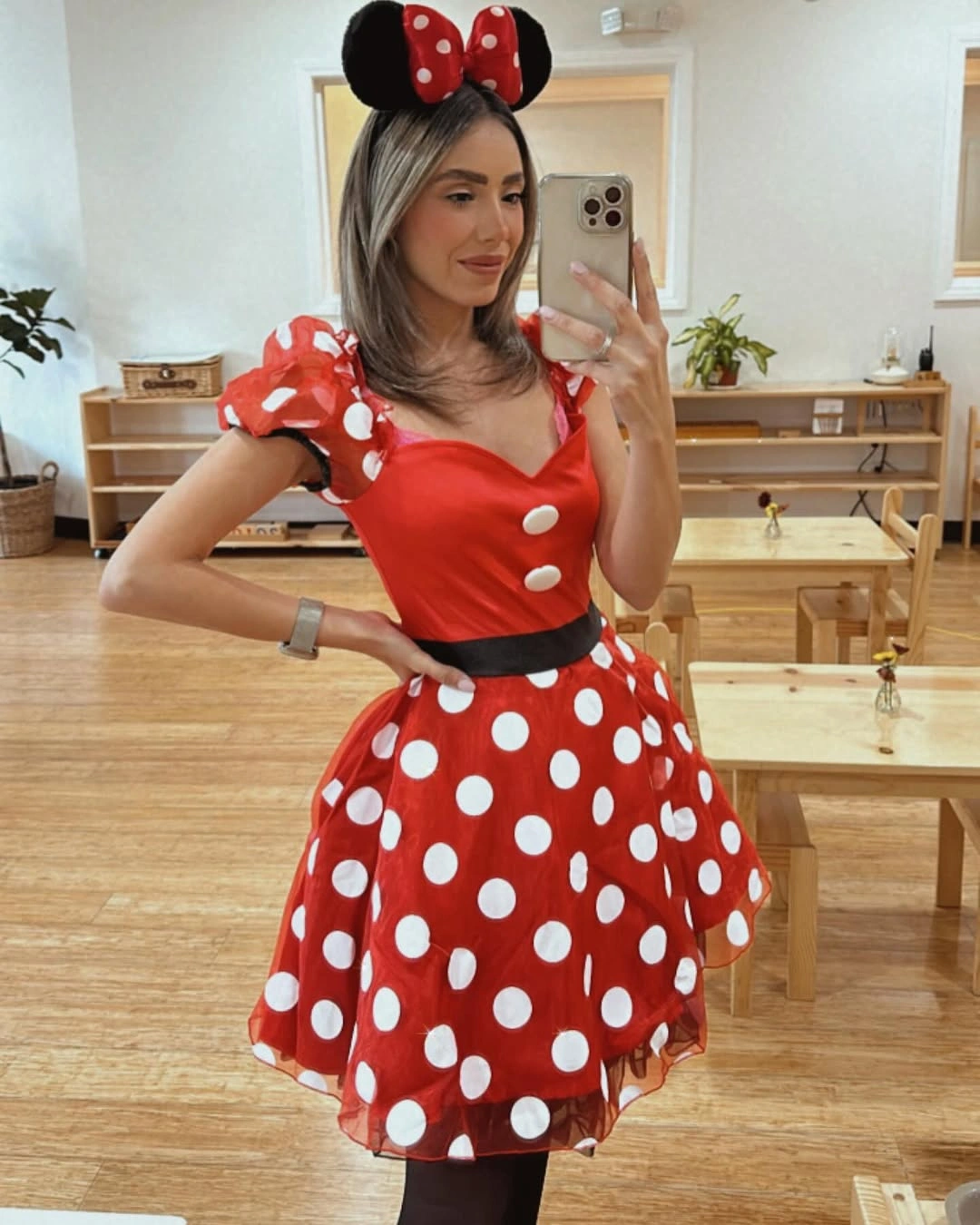 Minnie Mouse Halloween costume with red polka-dot dress and black ears
