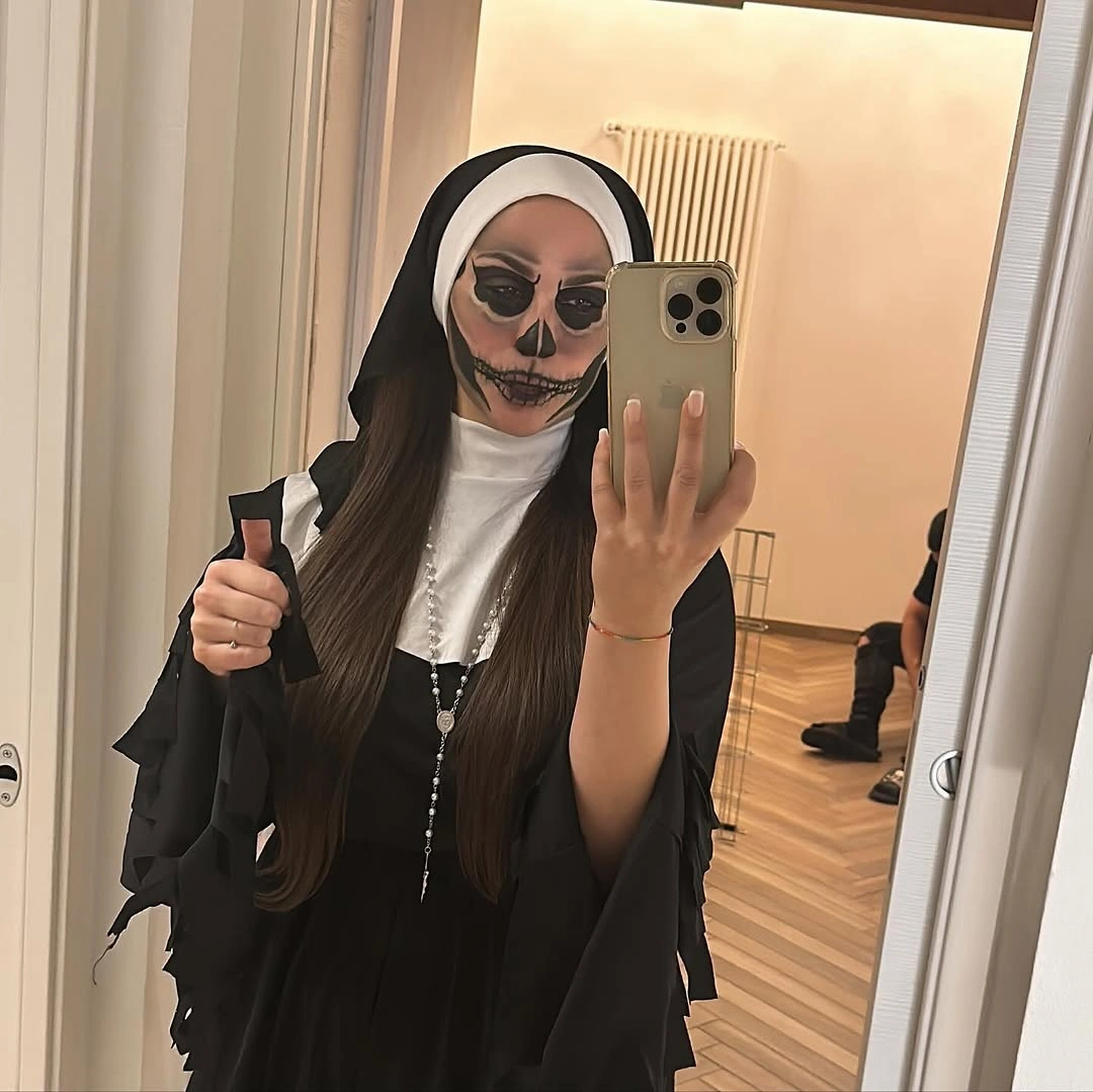 Valak the Nun horror costume with black habit and skeletal face makeup