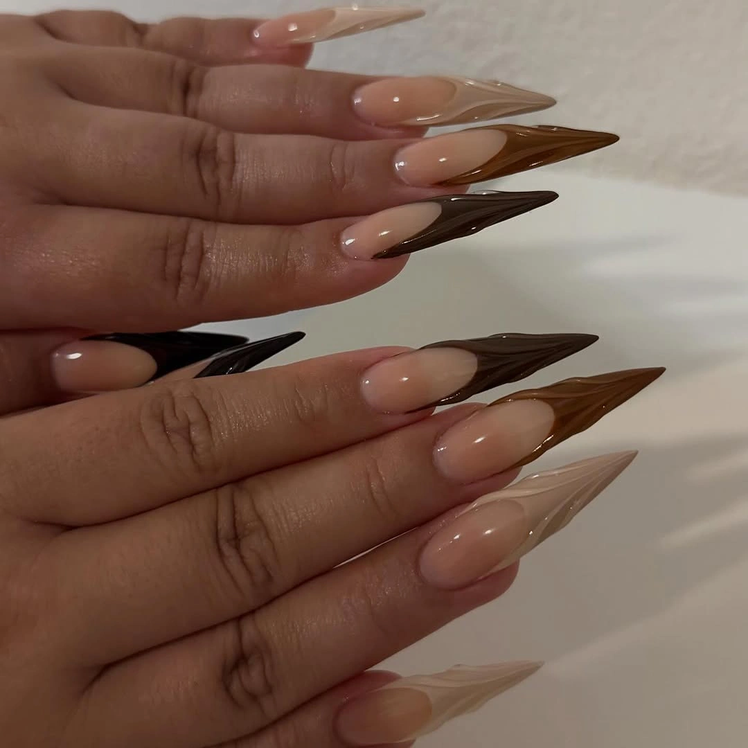Long almond nails with sheer centers and layered brown sections