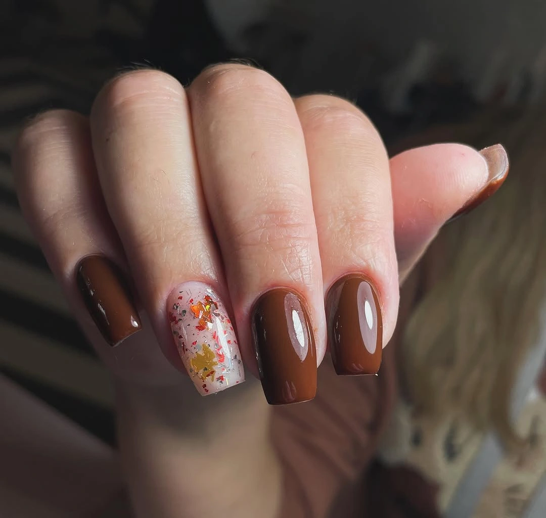 Long pointed almond nails in deep burgundy brown gloss