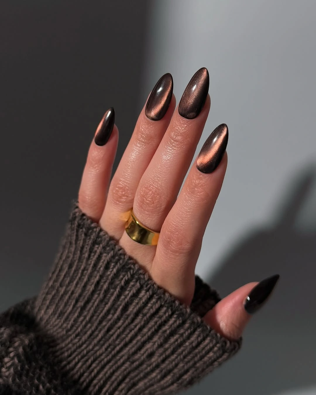Long almond nails with reflective bronze brown color