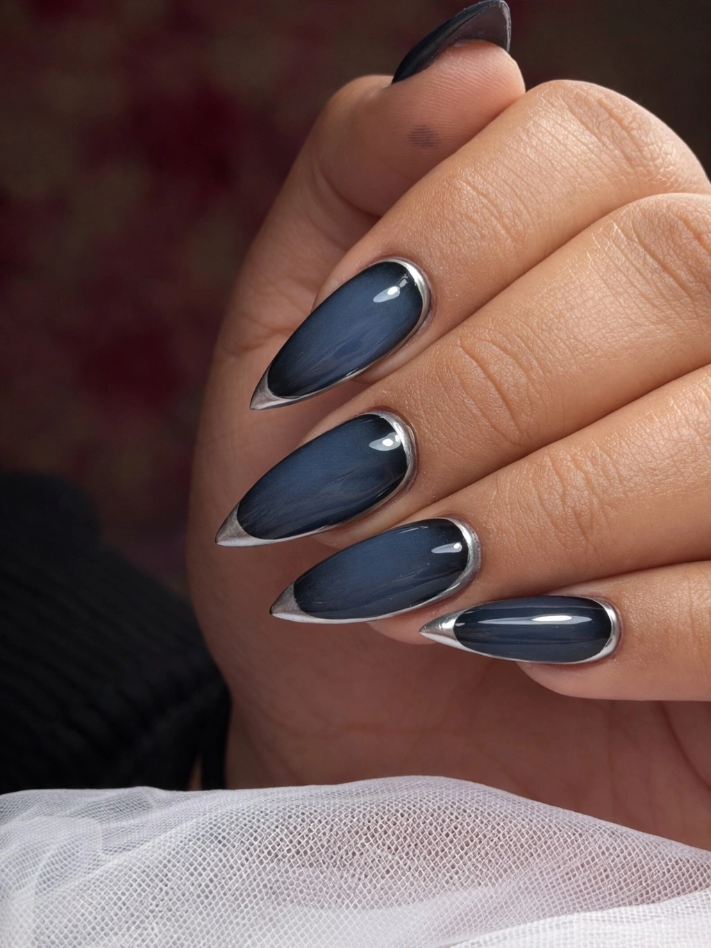 Medium navy-gray almond nails with silver chrome borders