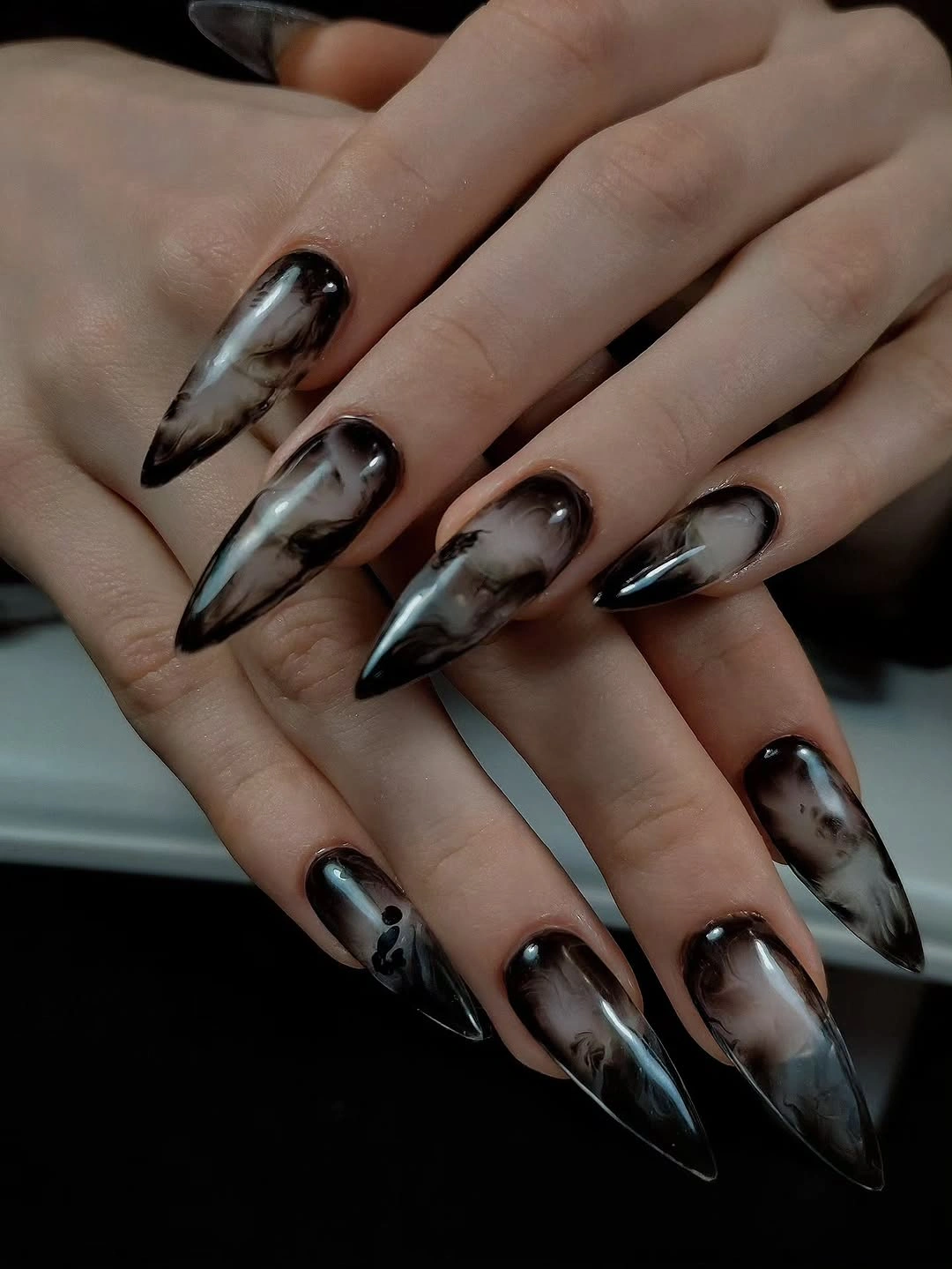 Long pointed nails with smoky black gray and metallic marbling