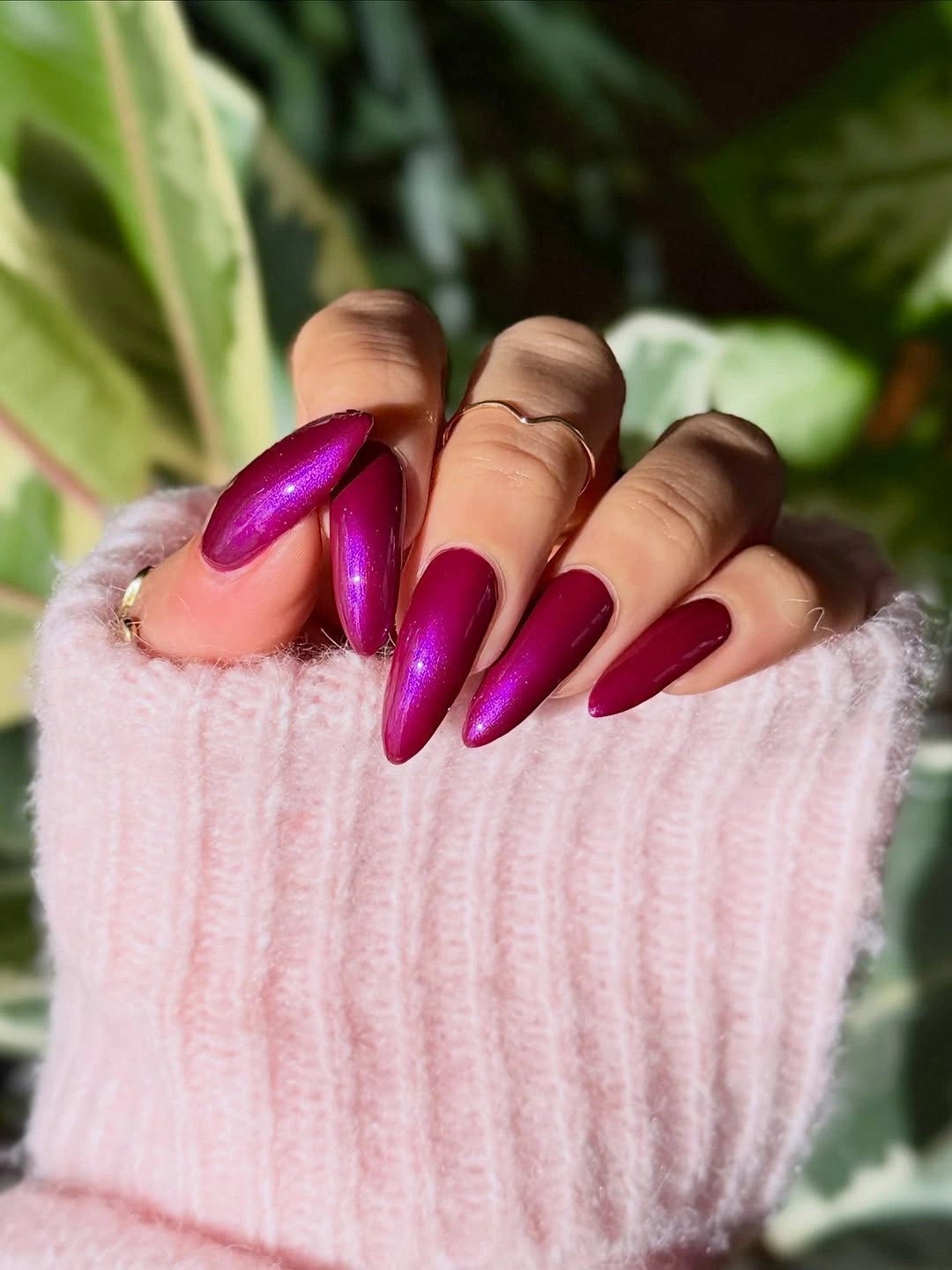 Long glossy berry-magenta pointed almond nails