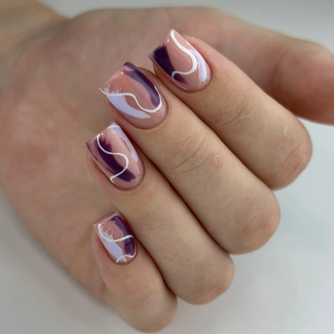 Short blush square nails with deep purple curved accents