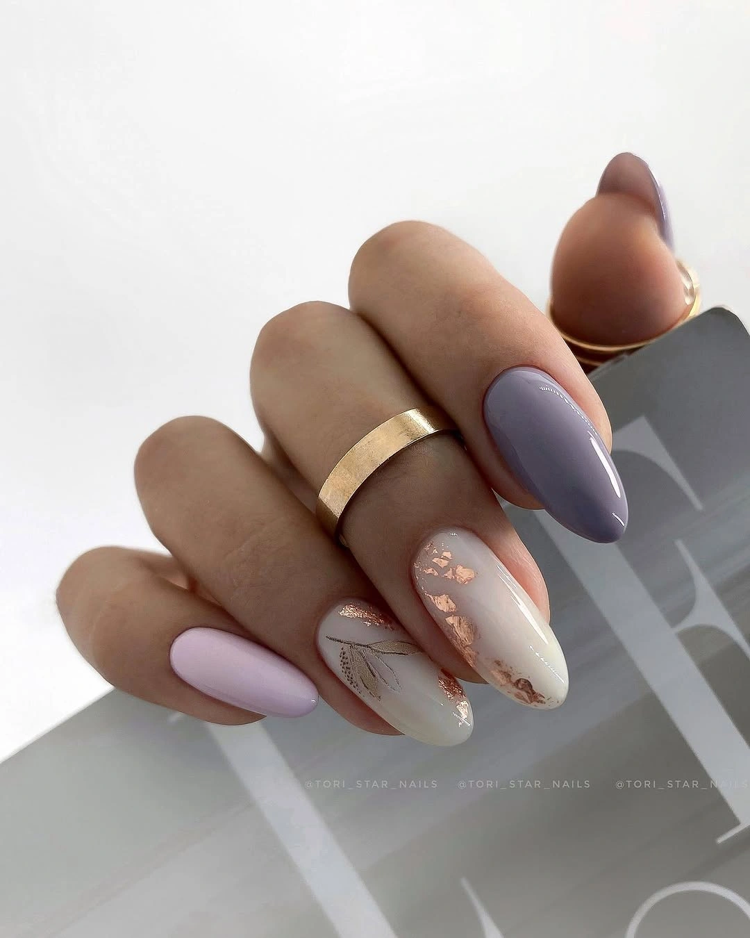 Lavender blush almond nails with a soft white accent panel