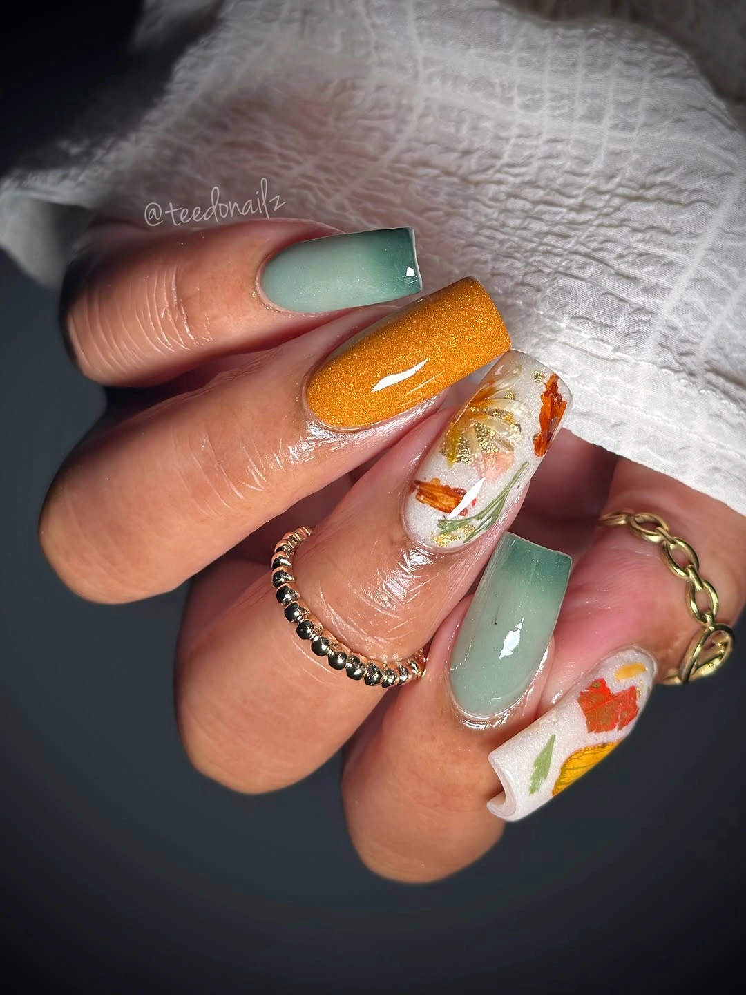 Mint square nails with burnt orange and botanical accent panels