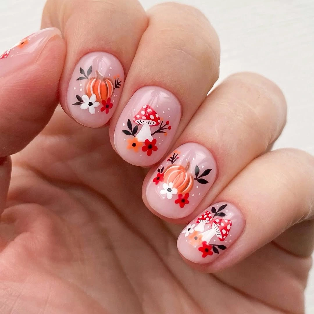 Short pink nails with tiny red orange flowers