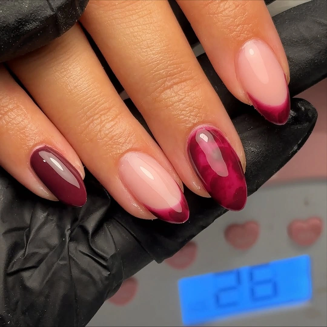 Glossy almond nails with burgundy ombre tips