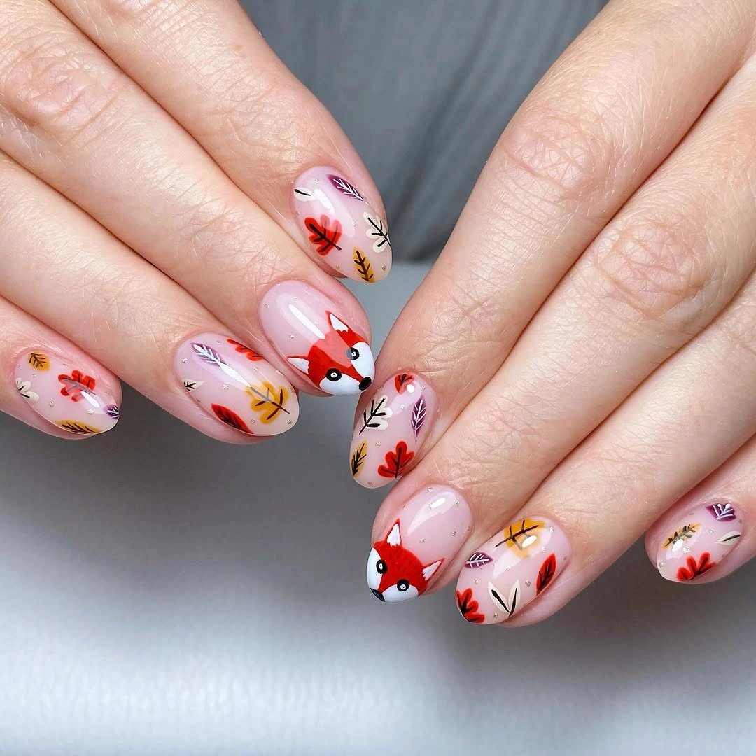 Pale short nails with scattered warm fall flowers