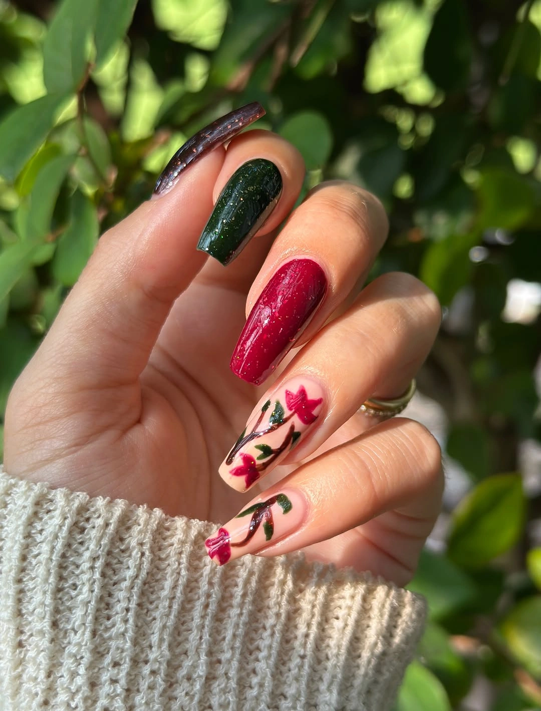 Almond fall nails with green red and floral accents