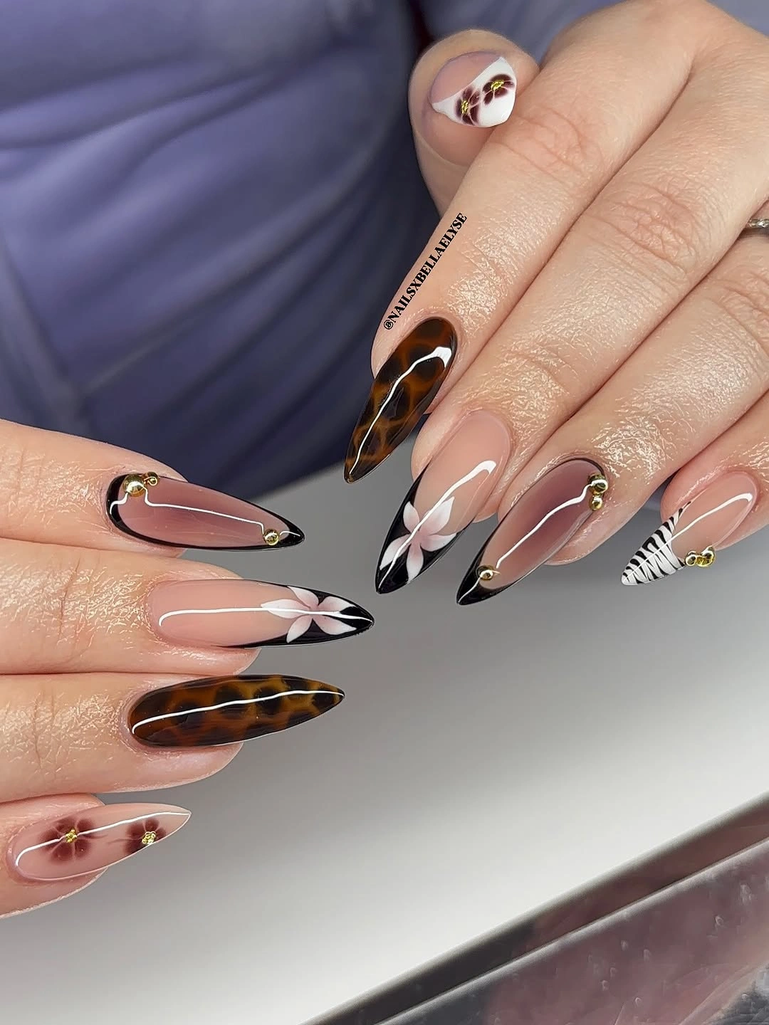 Long taupe nails with tortoiseshell tips and leaves