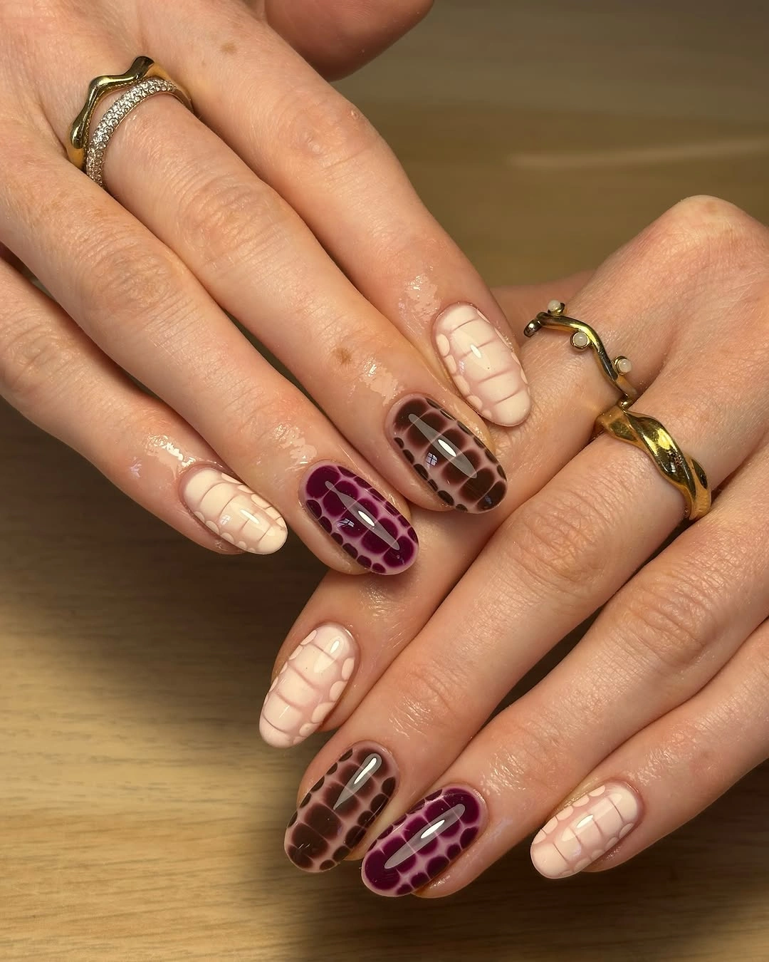 short almond nails with cream burgundy crocodile pattern