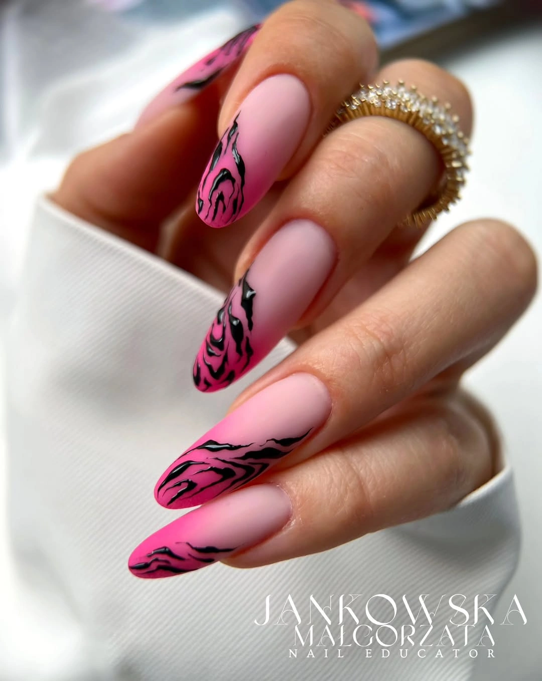 matte pink almond nails with hot pink zebra tips