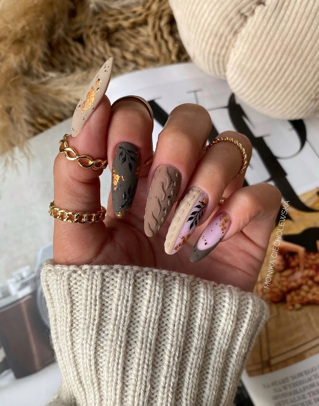 neutral almond nails with sweater texture and gold flecks