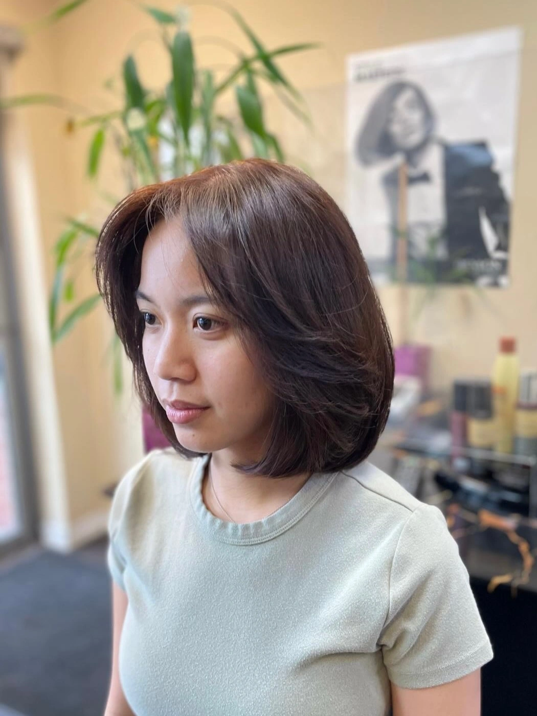 Short warm brown layered bob with softly lifted ends