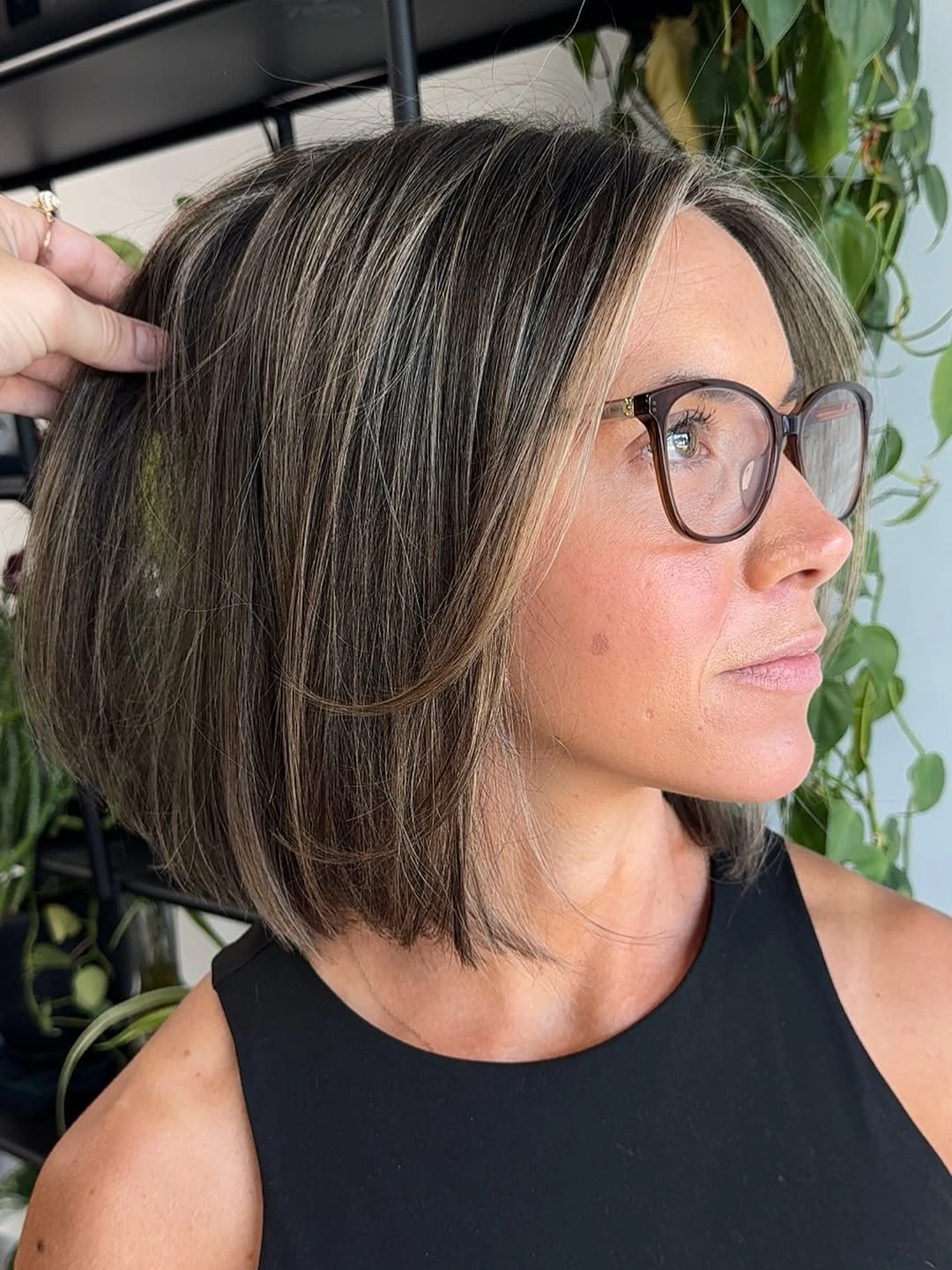 Medium dark brown bob with narrow beige face-framing ribbons