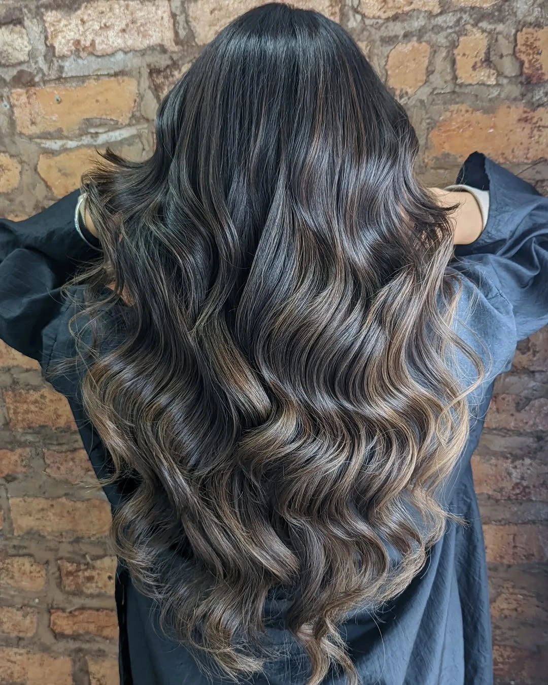 Cool brown waves with smoky ash-toned ribbons through the lengths