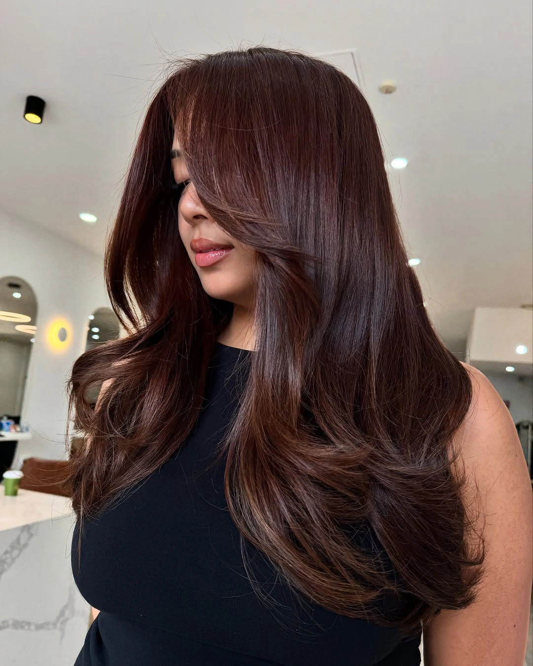 Long auburn-brown waves with rich copper warmth