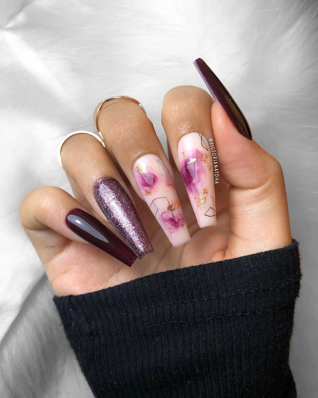 Long square burgundy nails with plum metallic and floral accents