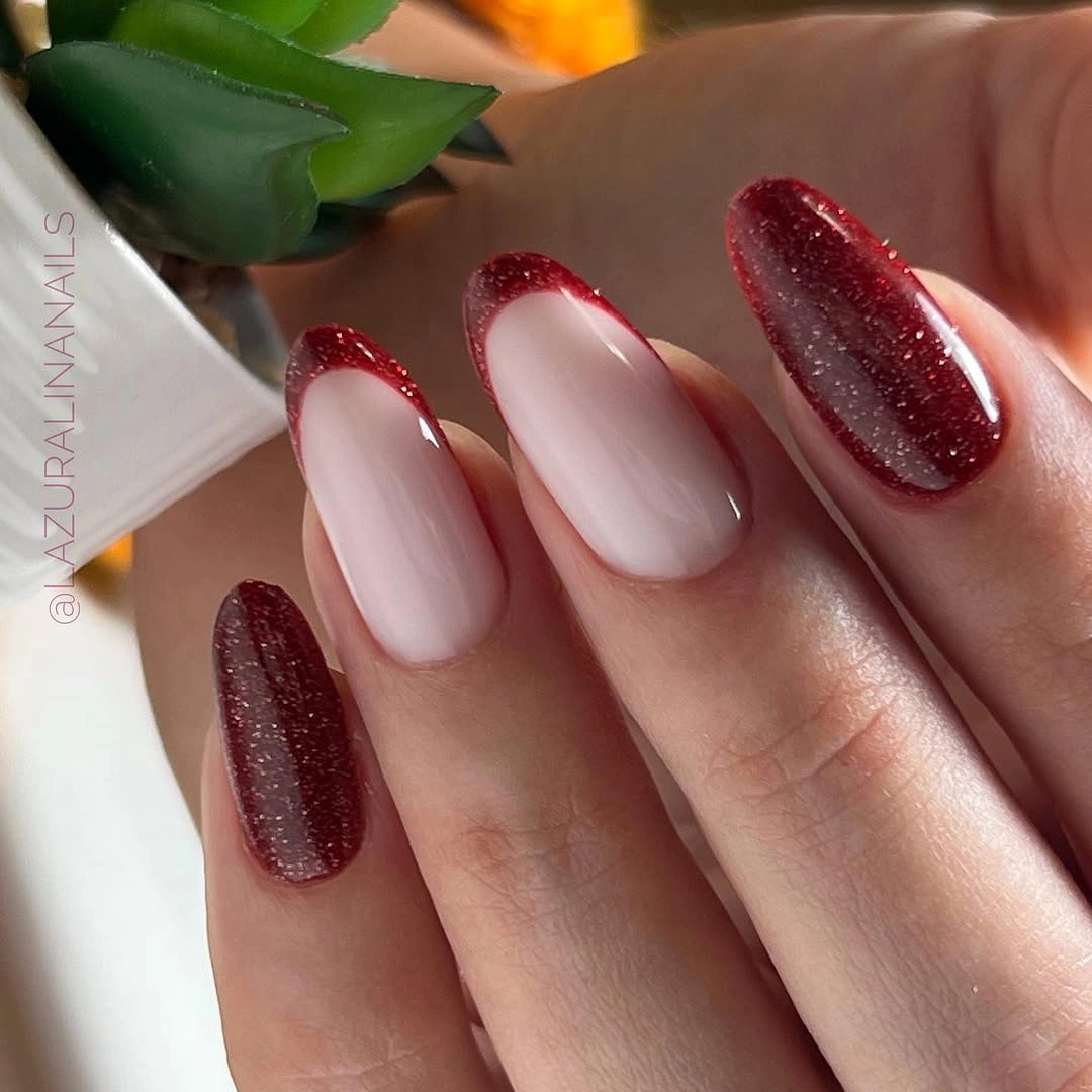 Medium almond nails with burgundy glitter French tips