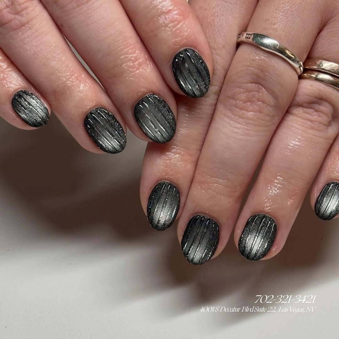 Short rounded gray nails with fine brushed texture