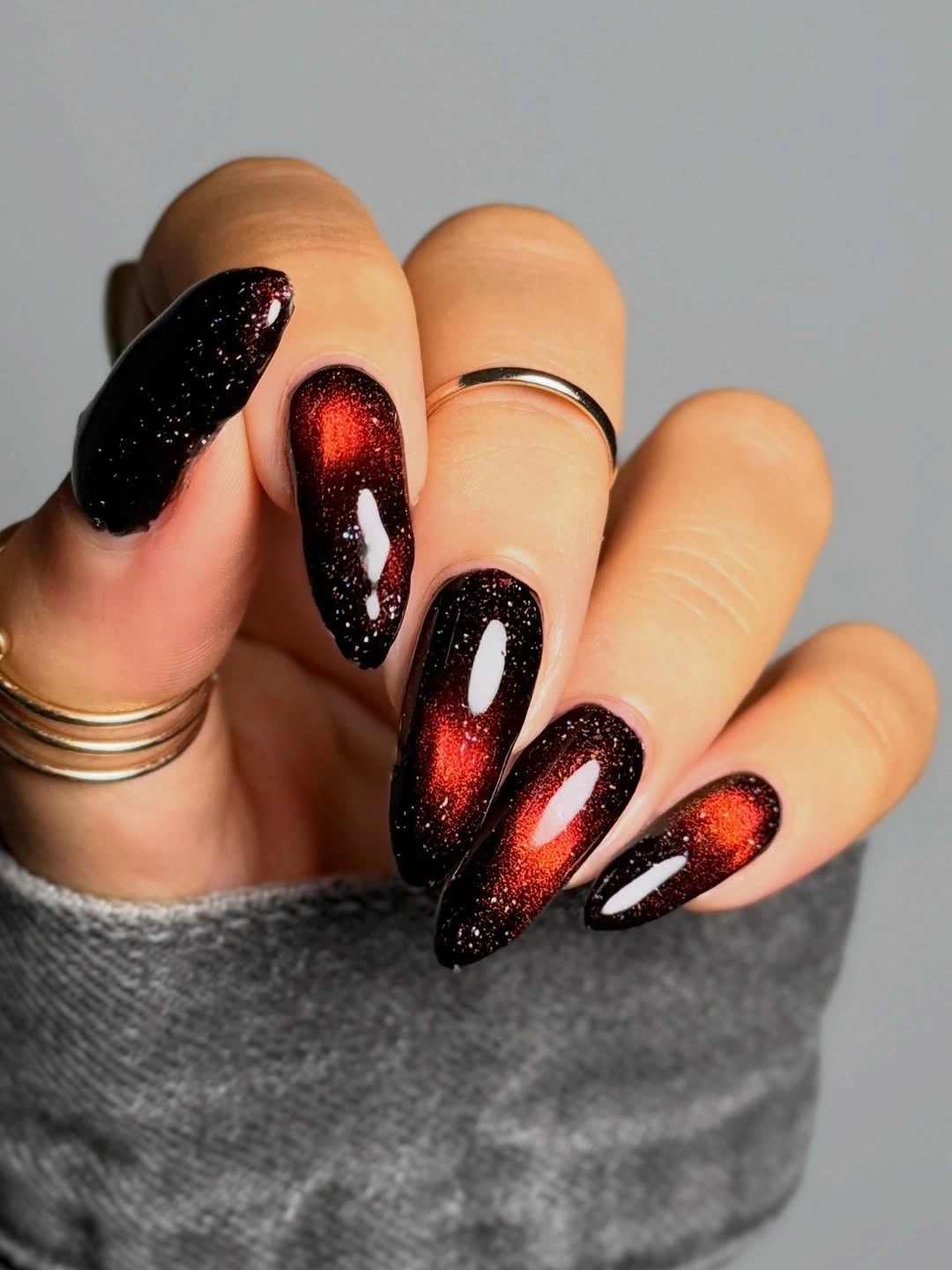 Long almond black nails with ember red centers