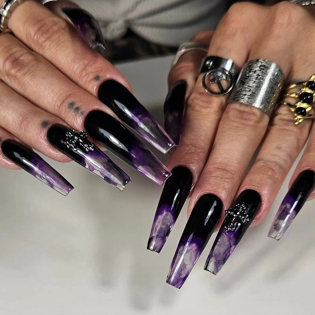 Very long square nails mixing black purple clear and sparkle
