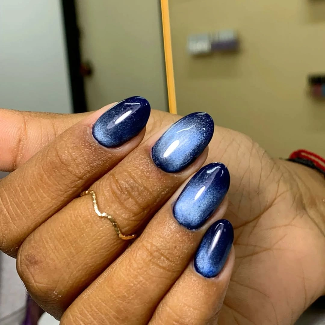 Medium almond cobalt nails with icy blue highlights