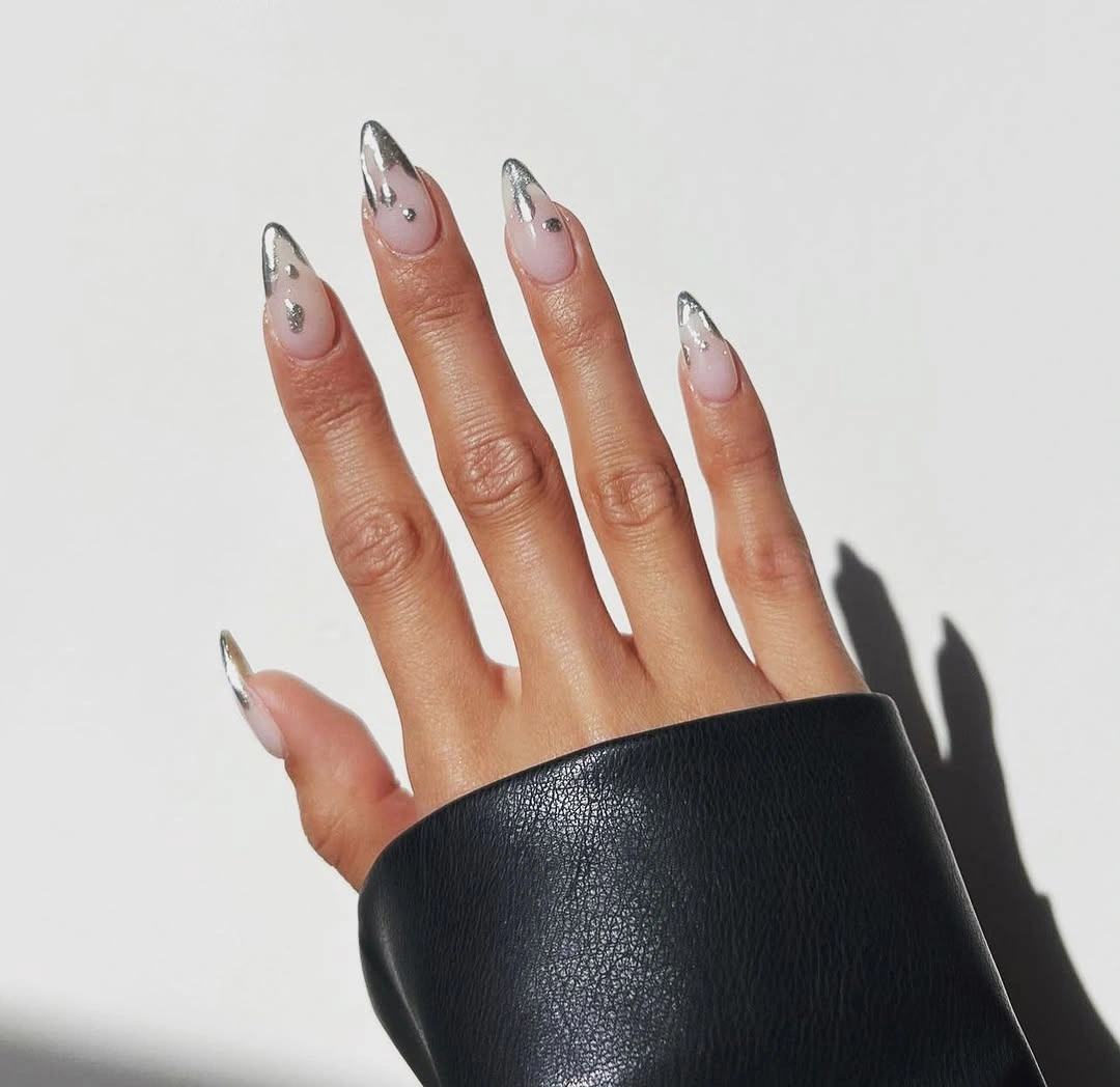 Long sheer almond nails with narrow black curved French-style edges