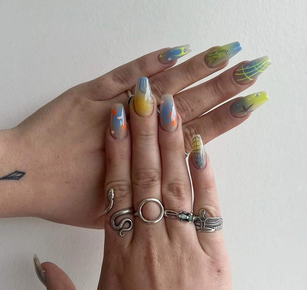 Short almond nails with pale base and bright lime yellow blue and coral abstract shapes