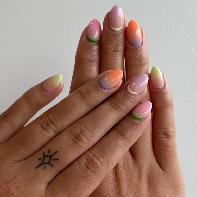 Almond nails with pastel pink peach lime lilac and blue curved accents