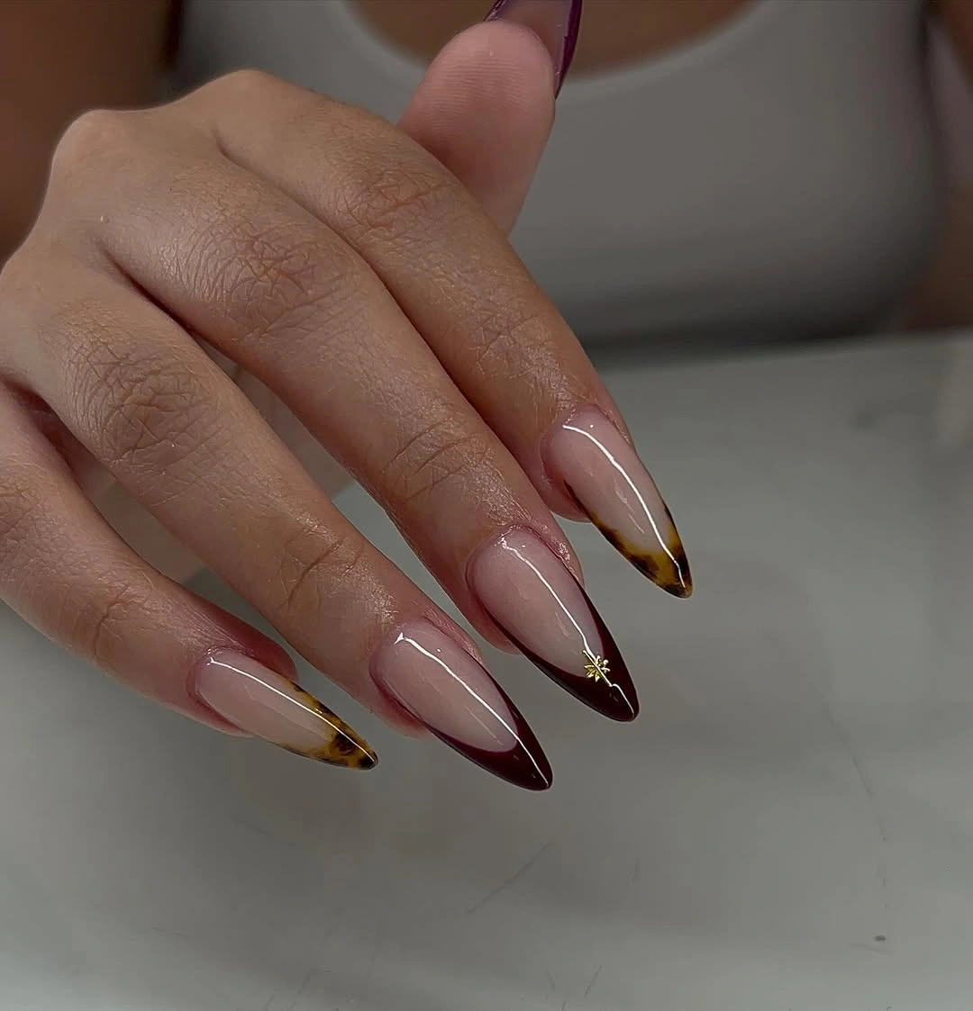 Long almond nails with brown white and gold French tips