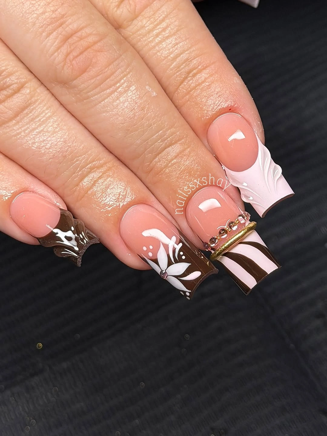 Medium almond nails with black white panels and light accent