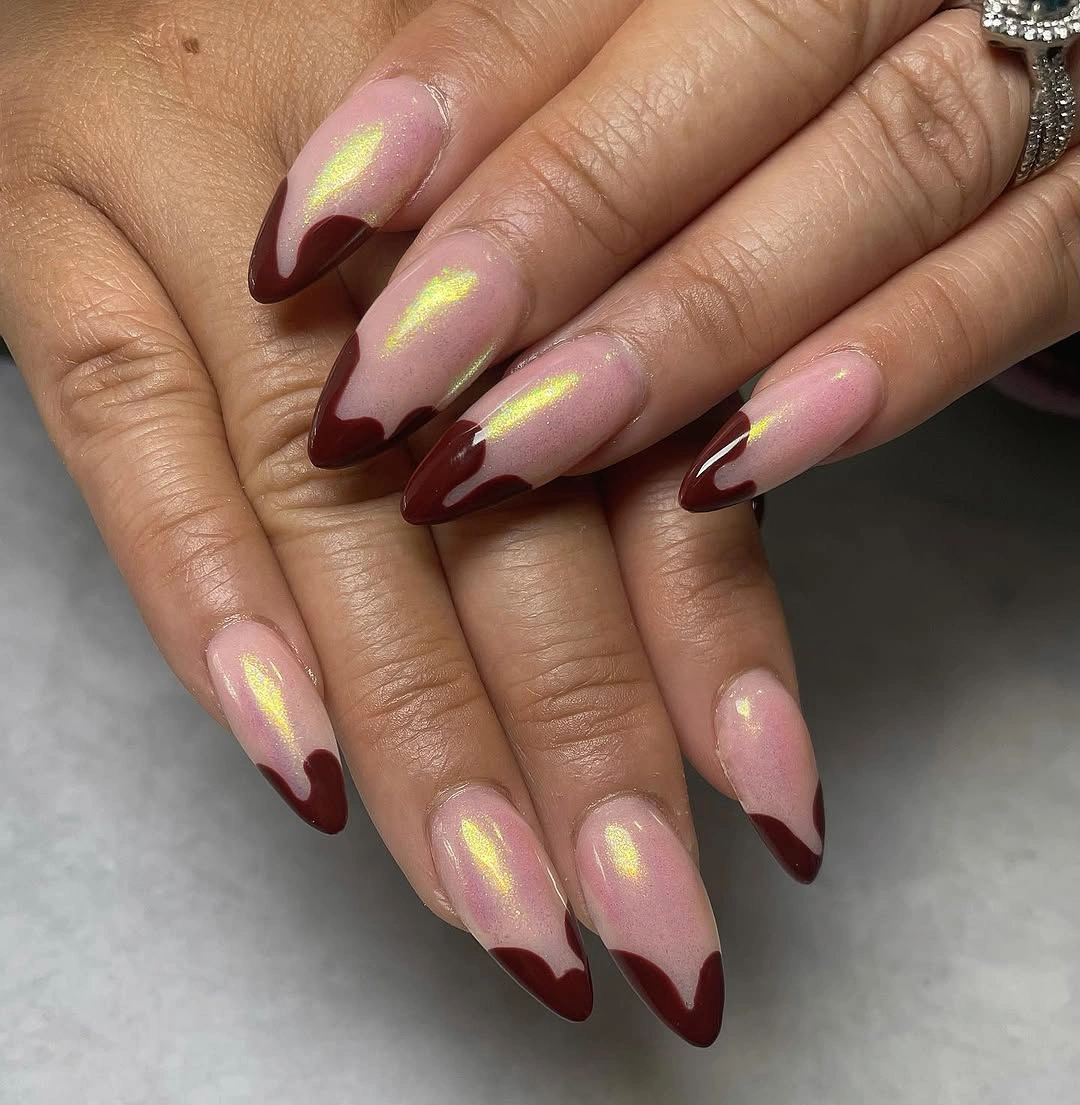 Blush almond nails with burgundy tips and lime accents
