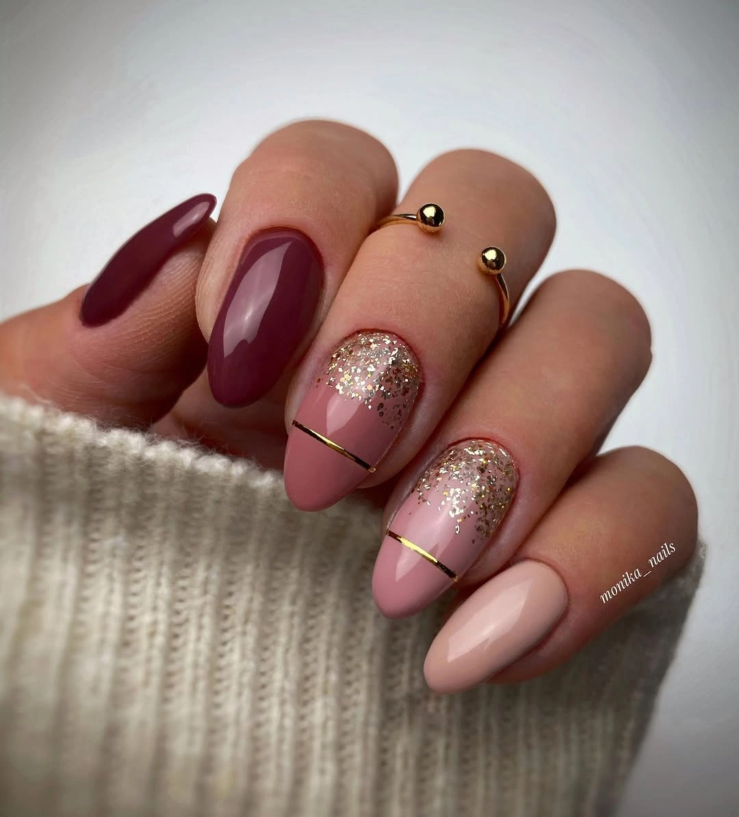 Long almond nails with burgundy pink and gold glitter panels