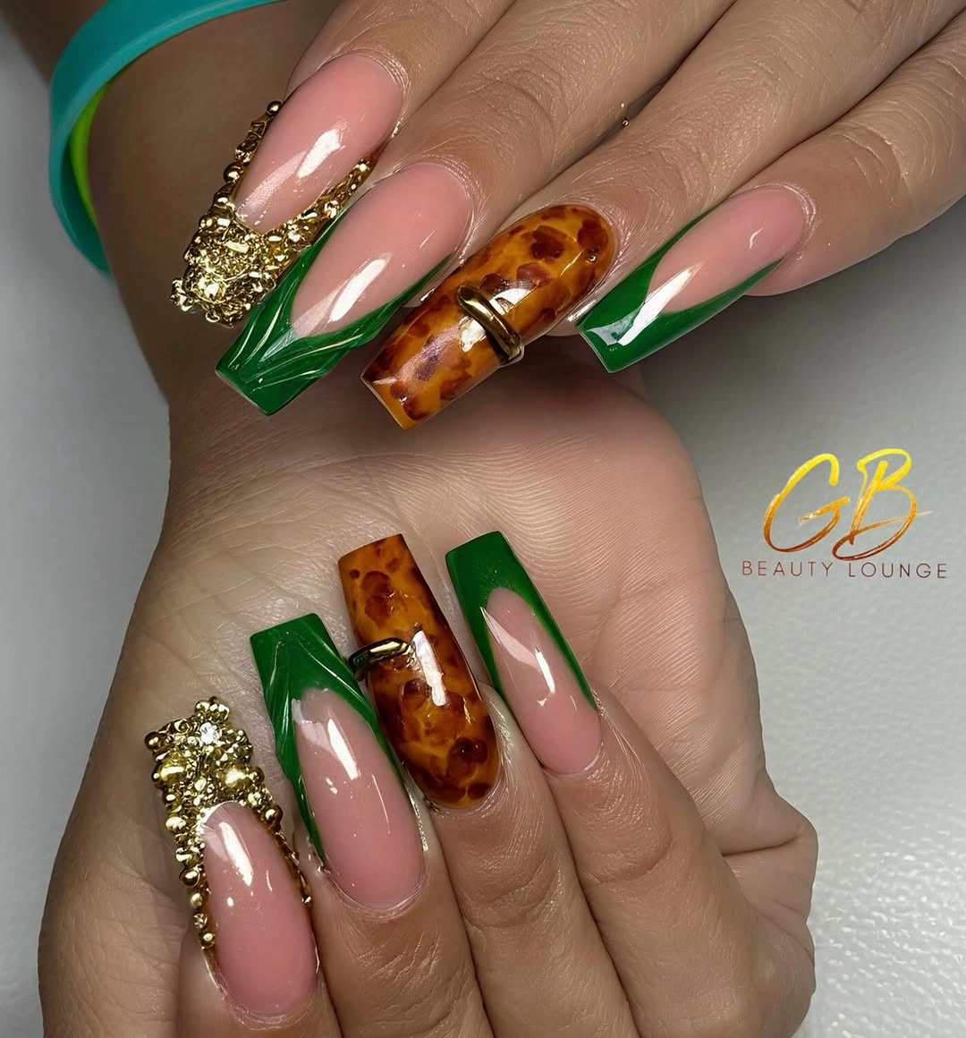 Long square nails with green tips amber panels and gold details