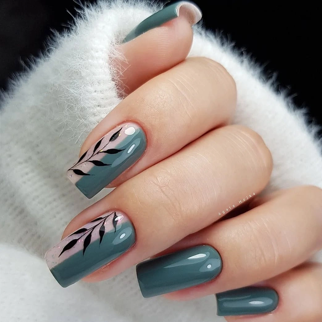 Blue-gray square nails with black leafy accent branches