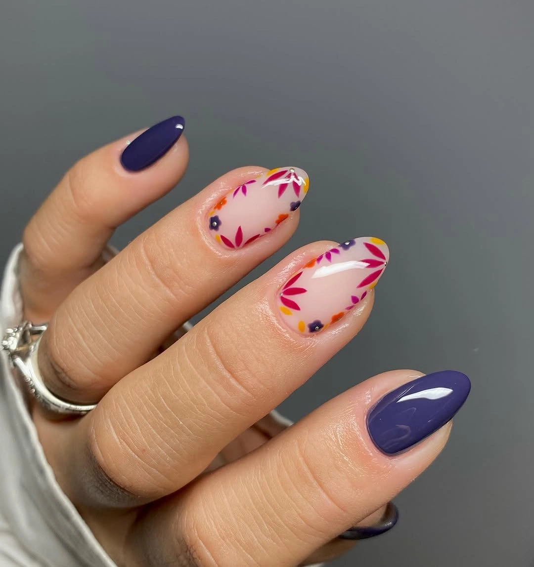 Purple almond nails with pink coral and white floral accents