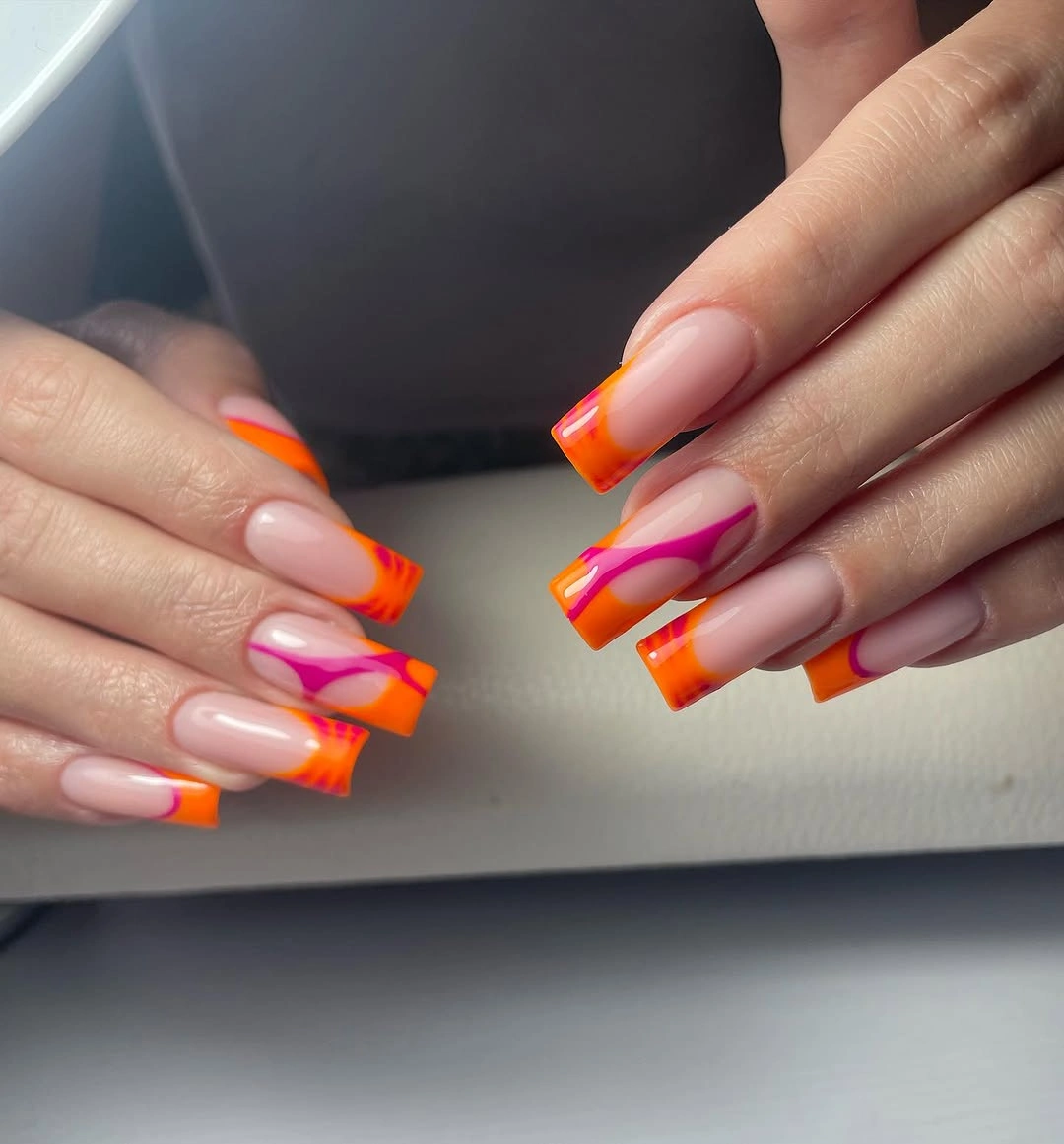 Long squared pink nails with neon orange and hot pink tip bands