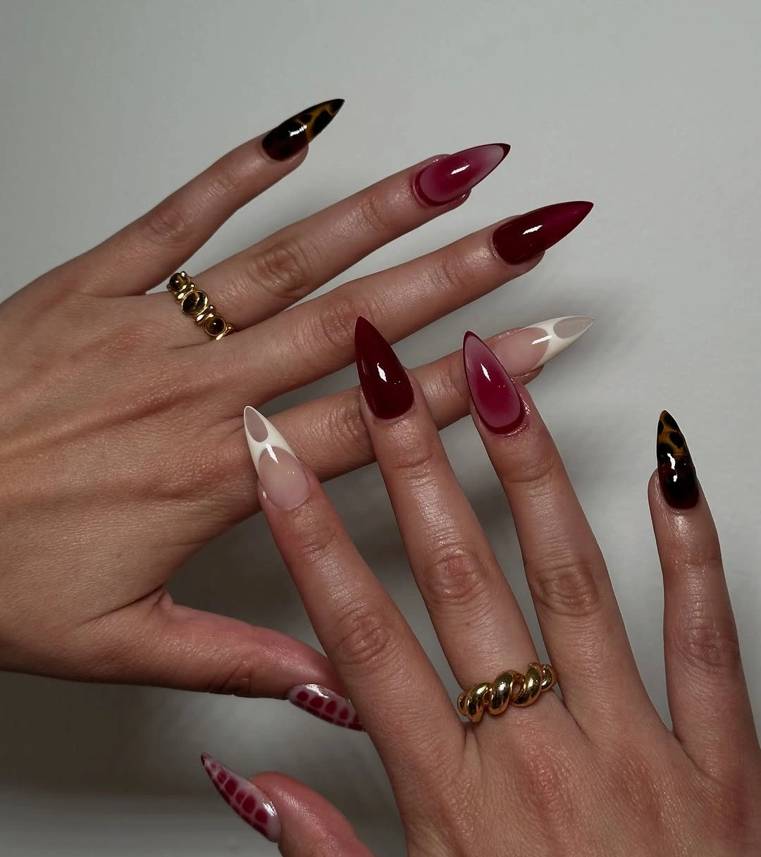 Mixed long almond nails in burgundy black blush and pale tips