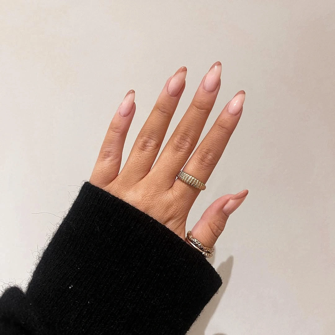 Long almond nails in pale blush with minimal fine edge detail