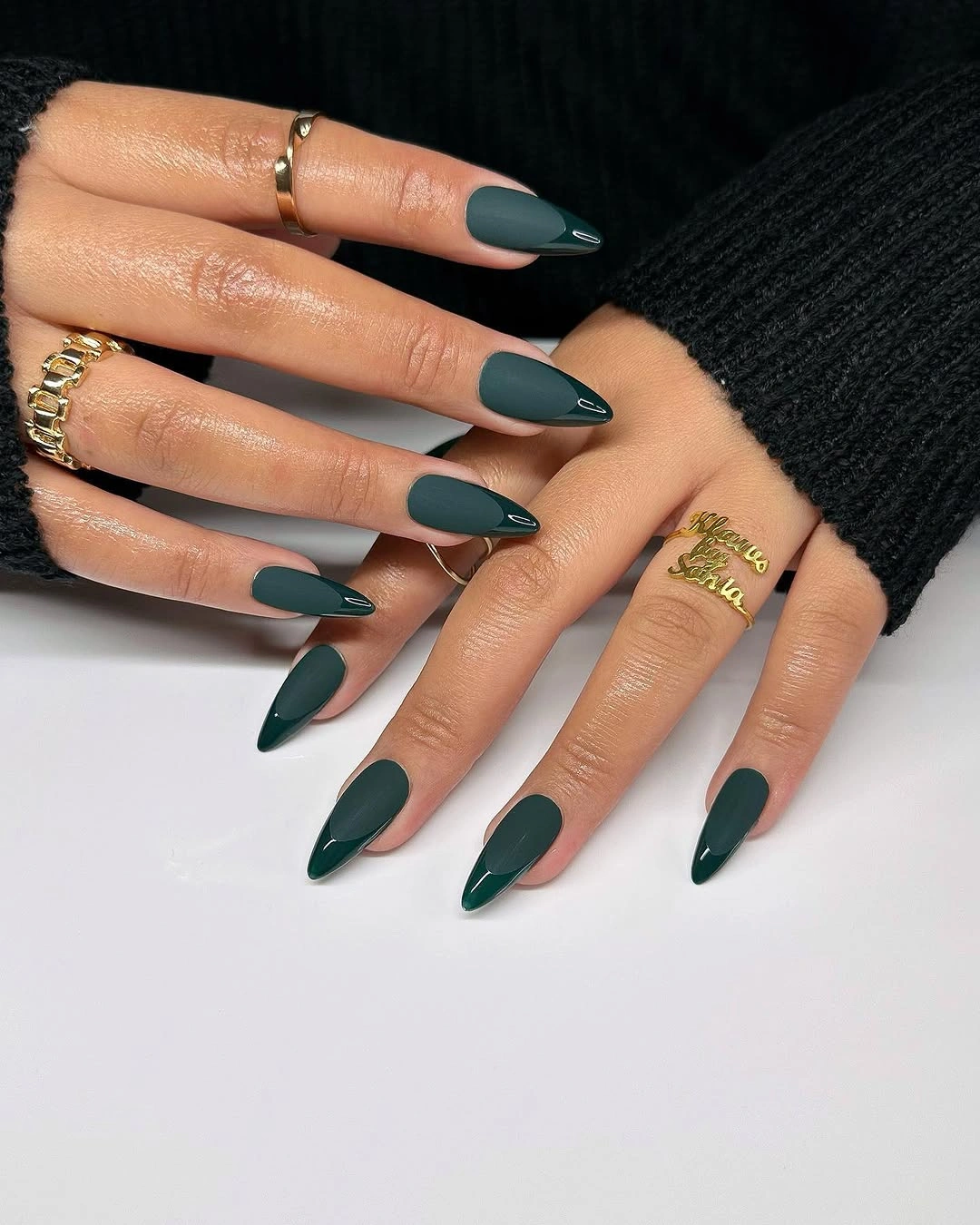 Long almond nails in deep glossy forest green color