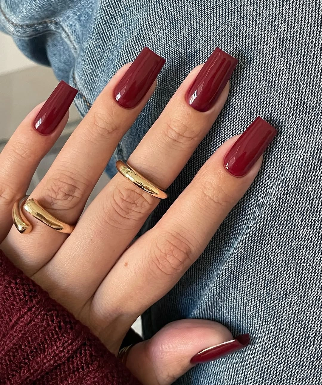 Long coffin nails in a glossy deep red fall manicure color
